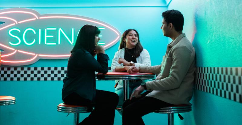 students at a diner table chatting
