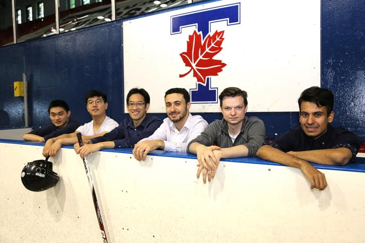 photo of Timothy Chan and students