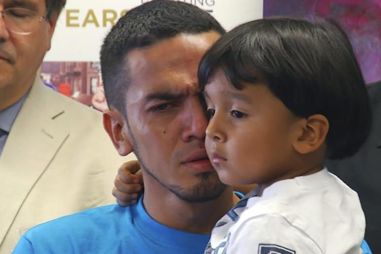 Photo of father and son reunited in U.S.