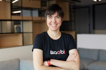 A portrait of Raquel Urtasun with her arms crossed, wearing a Waabi T-shirt