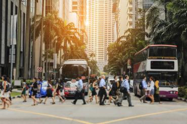 Photo of pedestrians crossing the street in Singapore