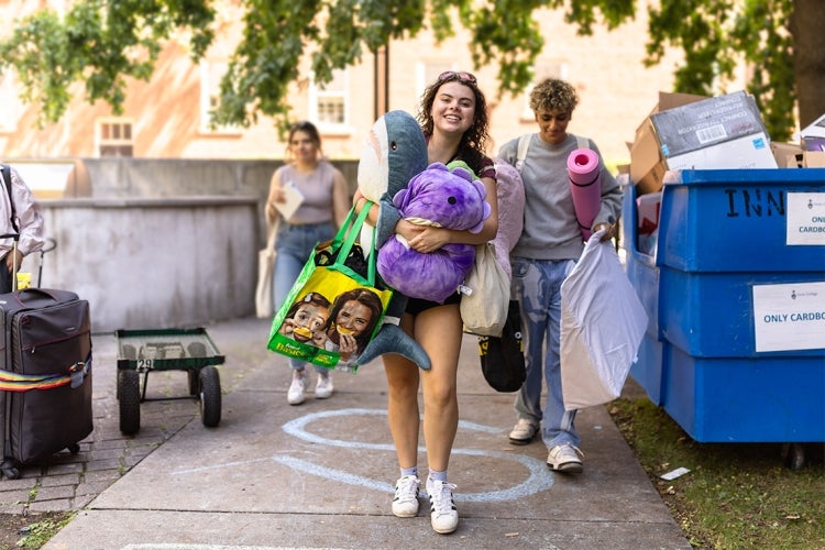 students carry their belongings to their dorms on the University of Toronto St. George campus