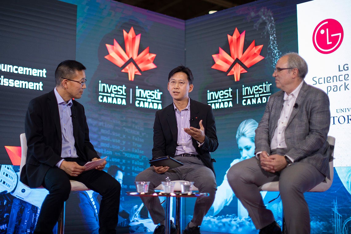 Chris Yip, U of T's associate vice-president of international partnerships, on stage at the Collision conference with LG representatives 