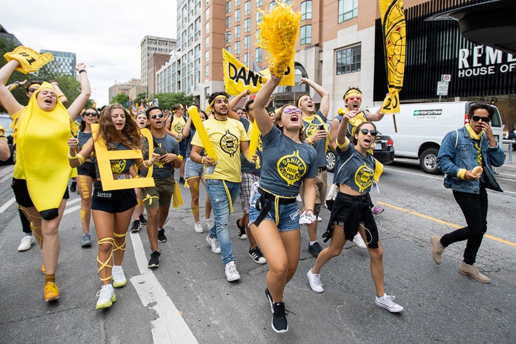 Students from Victoria College during the tri-campus parade along Bloor Street