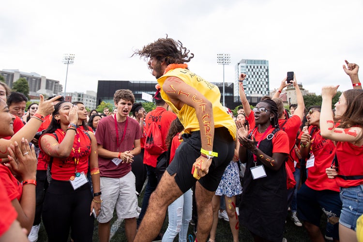 Students from Victoria College during the cheer-off in Varsity Stadium at the University of Toronto