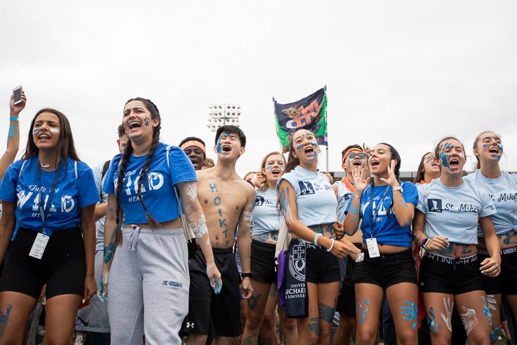 Students from St. Michael's College belt out their best line during the cheer-off in Varsity Stadium at the University of Toronto