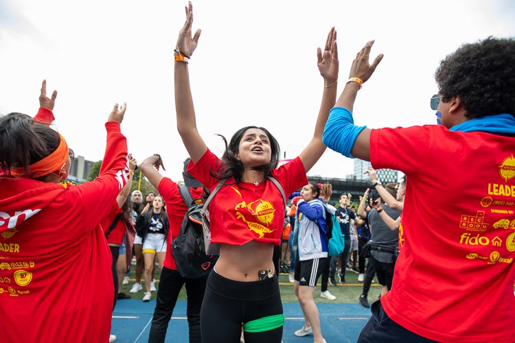 Students from University of Toronto Mississauga during the cheer-off in Varsity Stadium at the University of Toronto