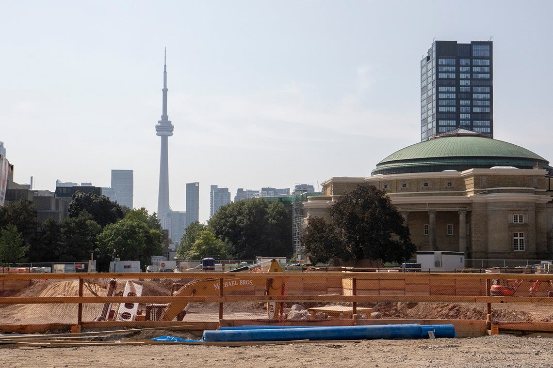Construction on front campus with the cn tower and convocation hall seen in the background