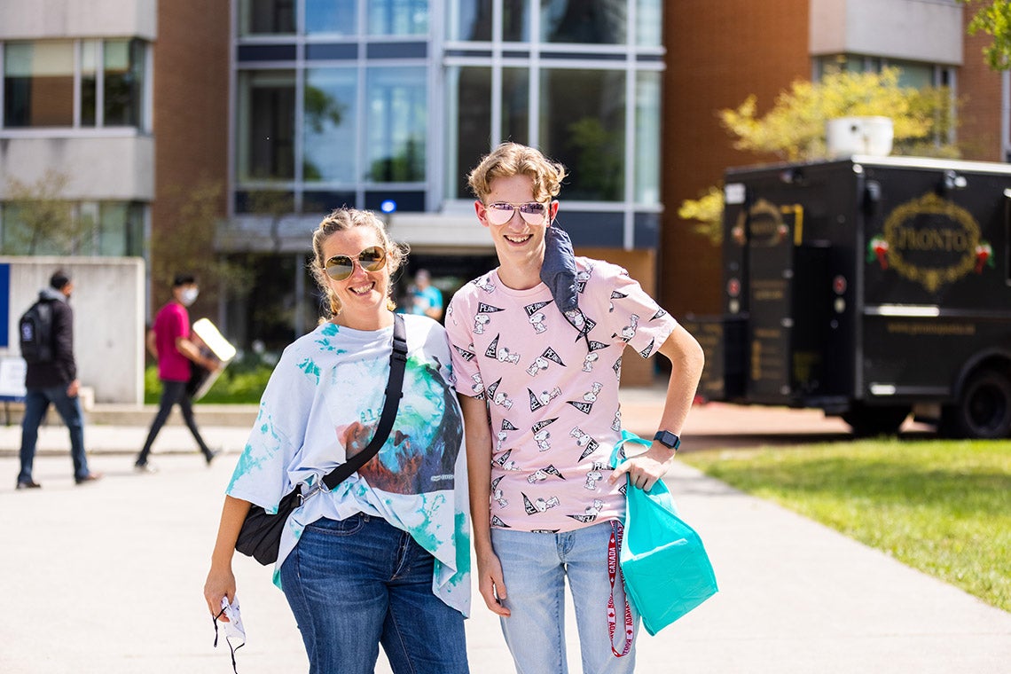 two students smile for the camera at the University of Toronto Scarborough campus