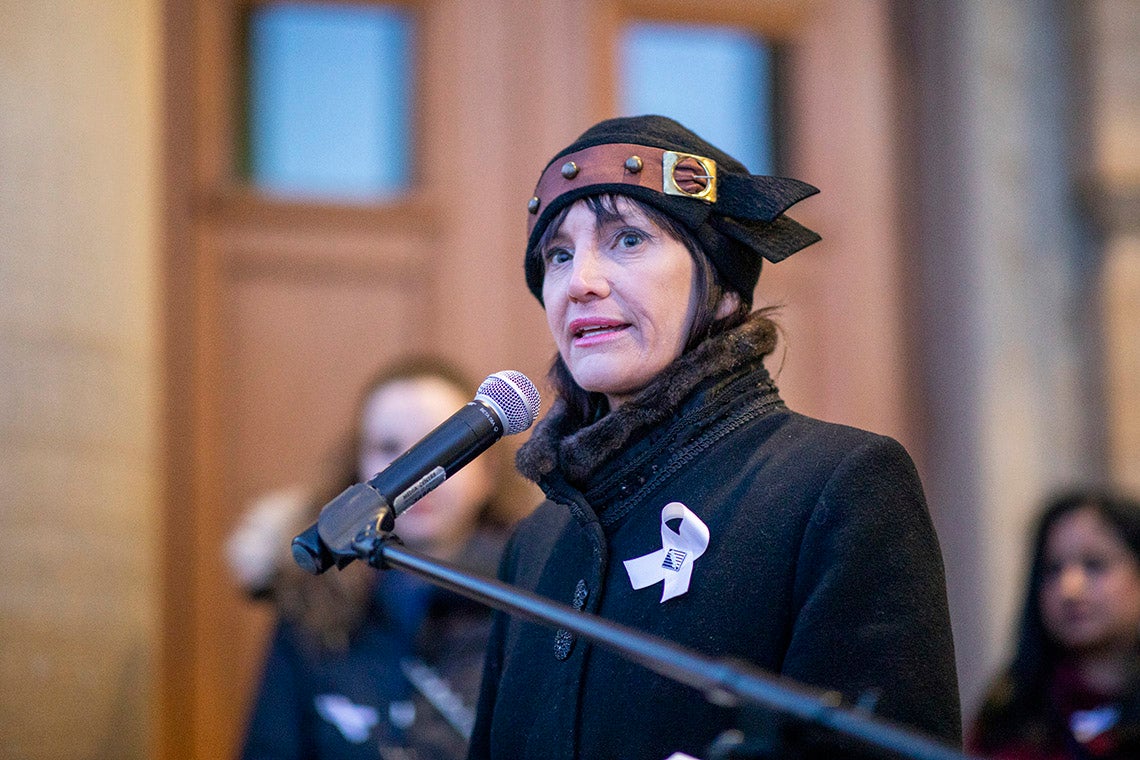 Marisa Sterling speaks outside convocation hall on the national day of remembrance 2019