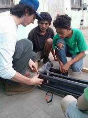 photo of boyce and community members working on windmill