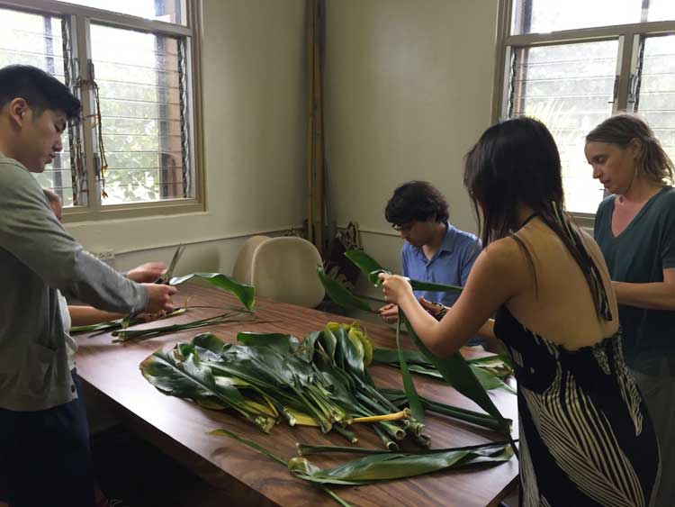 photo of students making leis