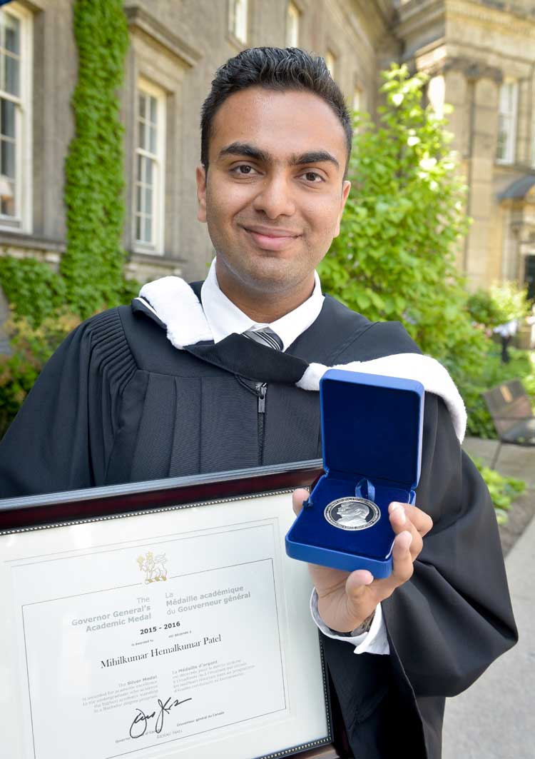 photo of Patel with medal and certificate