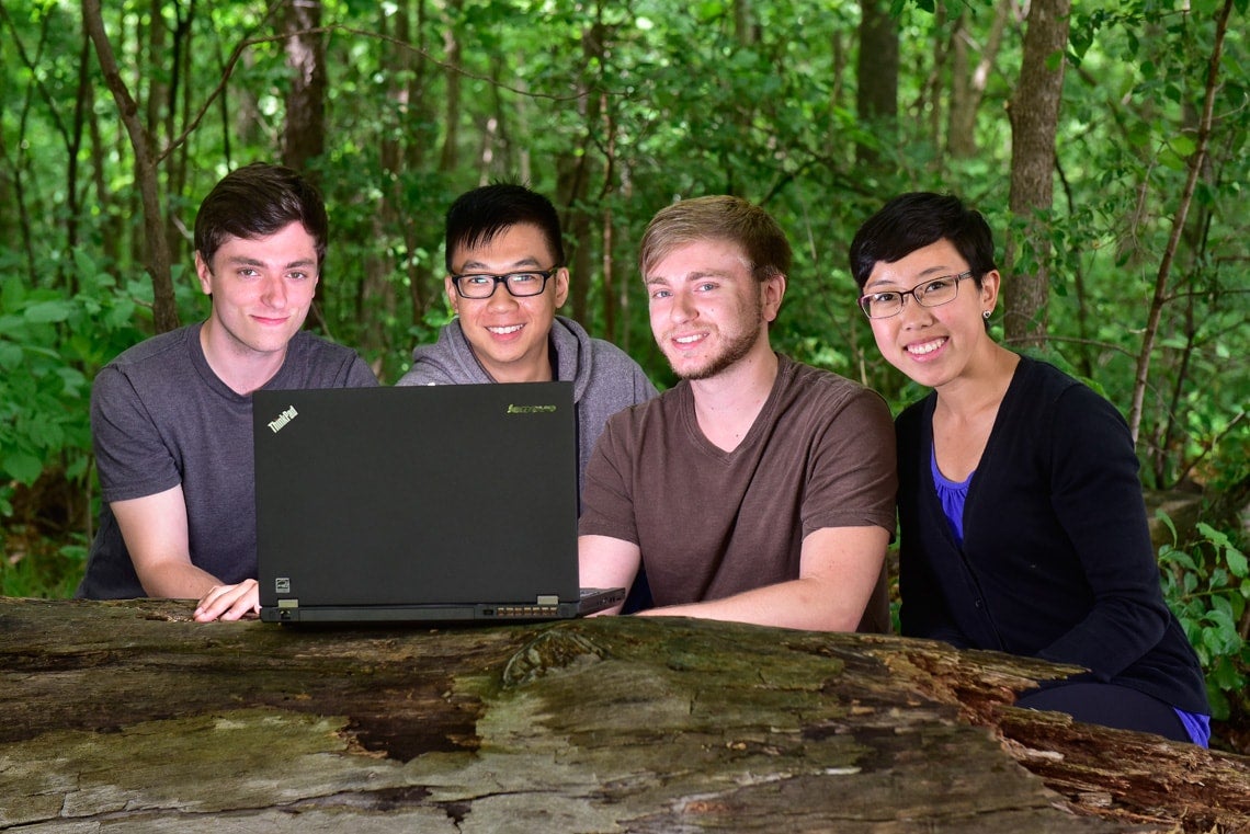 photo of the students with laptop in park