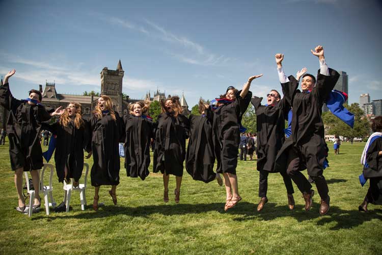 A photo of graduates jumping 