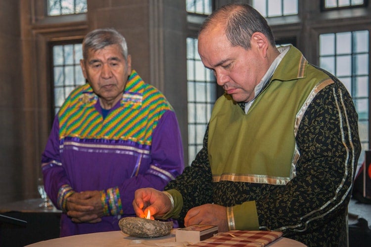 photo of elders lighting flame