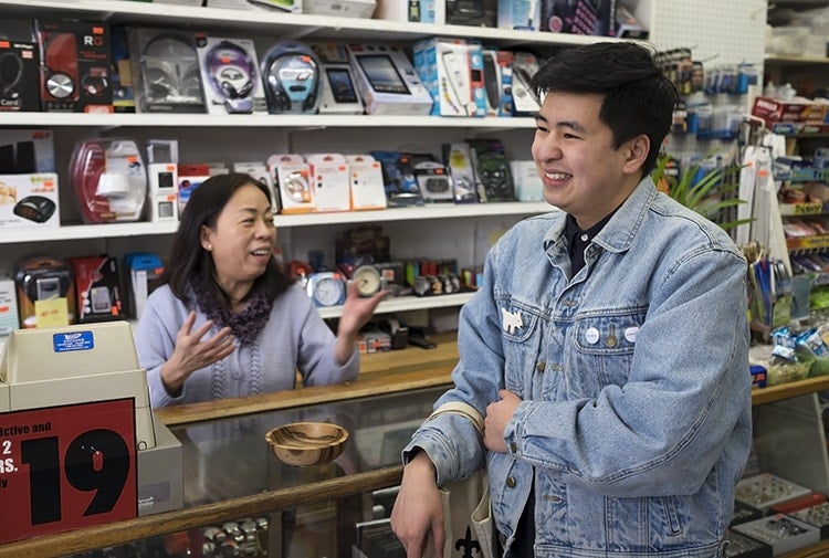 Picture of Phat Le and his mom in their family's convenience store on Queen St W 