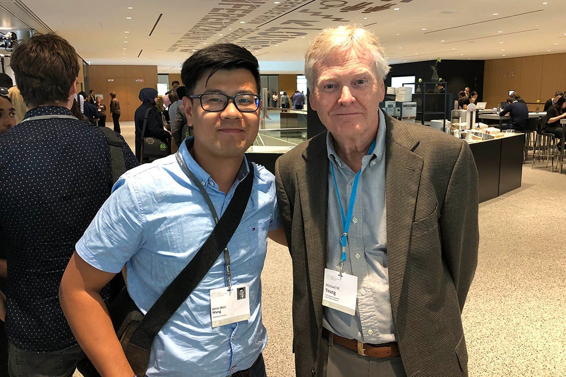 Photo of Kevin Wang with Nobel Laureate Michael Young