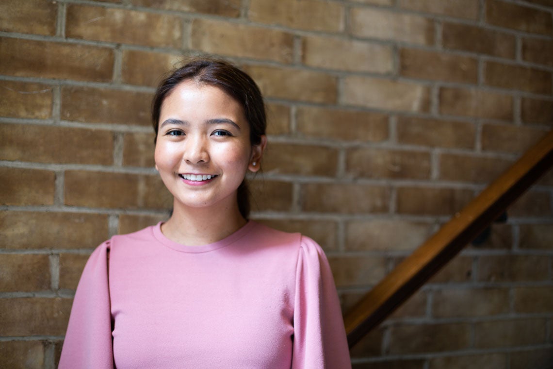 photo of Tsering Wangmo in front of brick wall