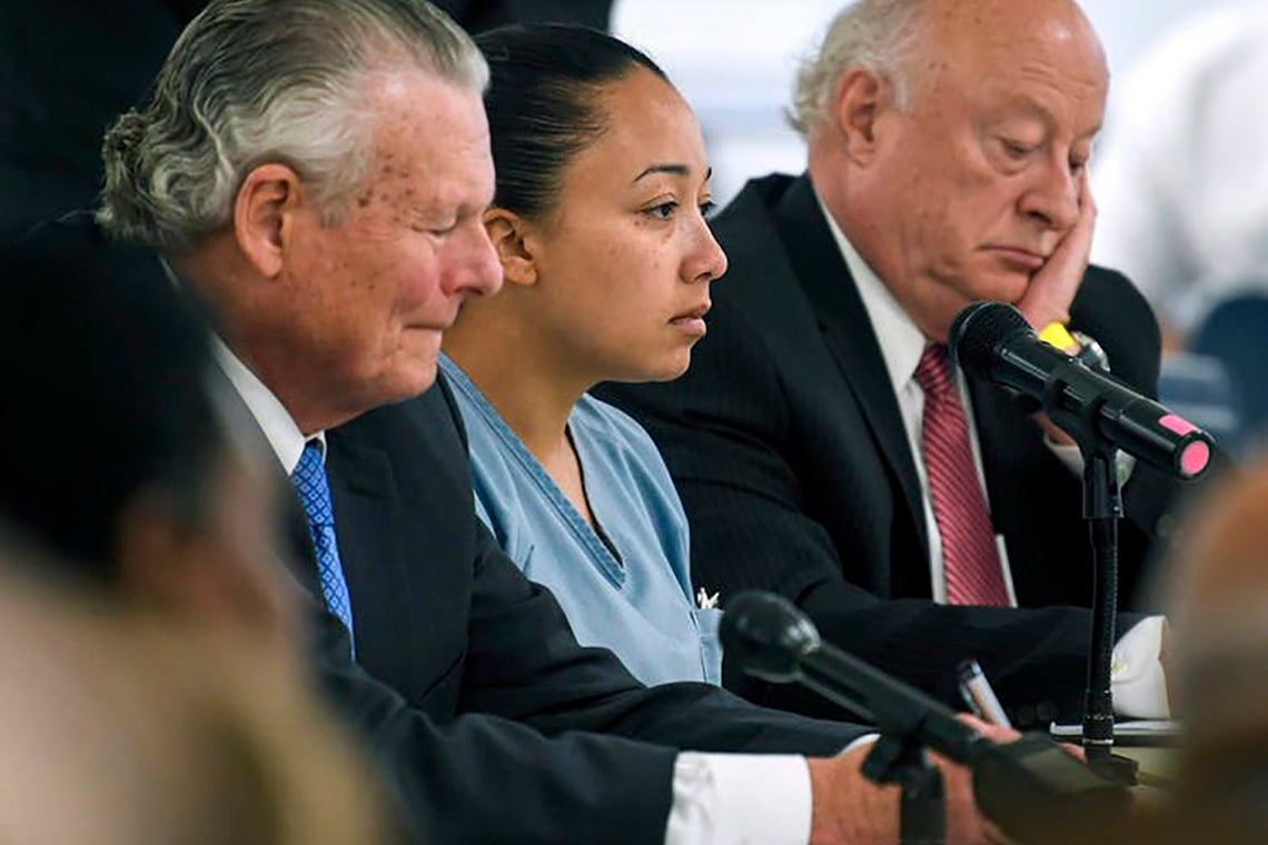 Photo of Cyntoia Brown and lawyers