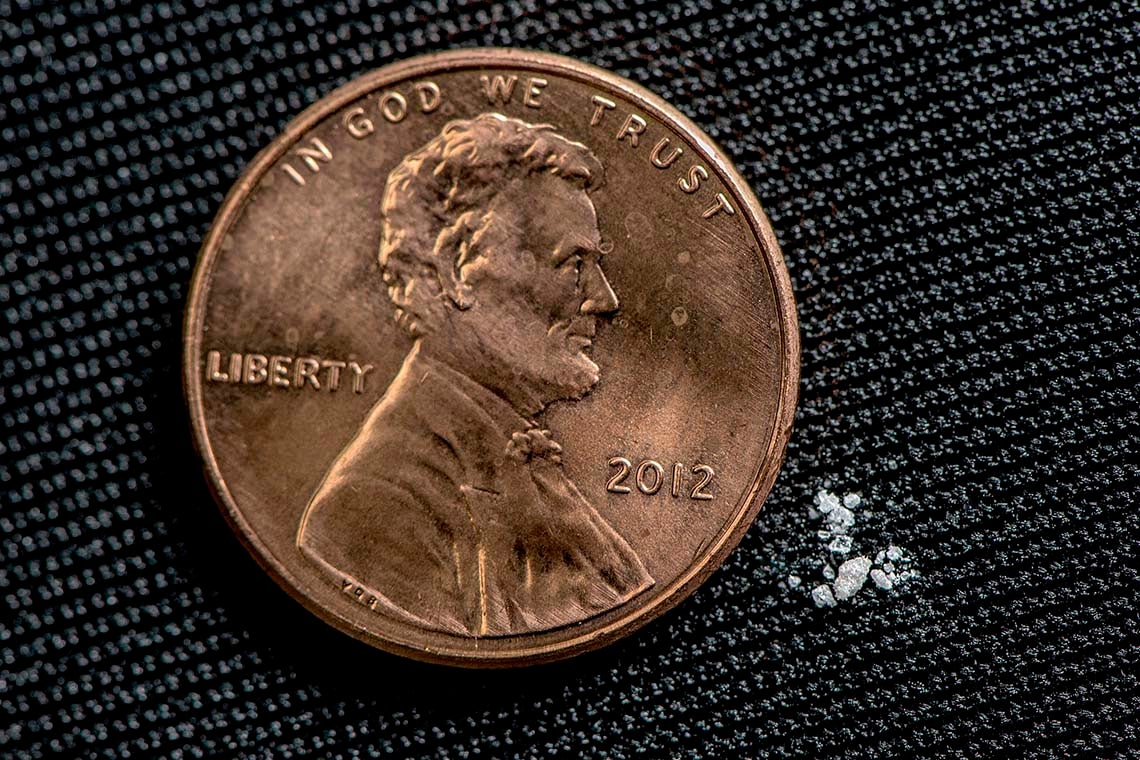 Photo of penny beside lethal dose of fentanyl