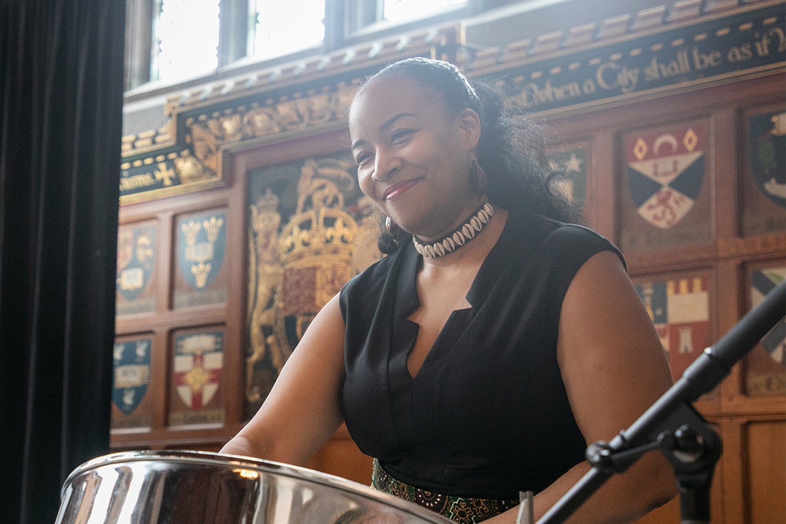 a woman play a steel drum at hart house black history month luncheon 2020