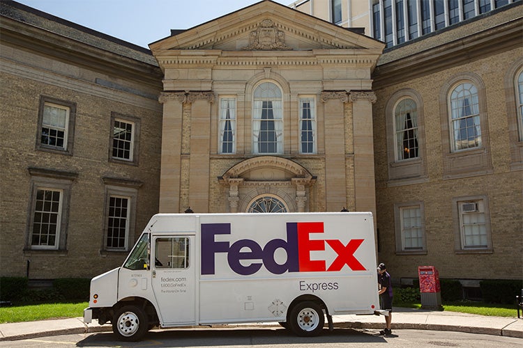 fedex truck waits outside simcoe hall
