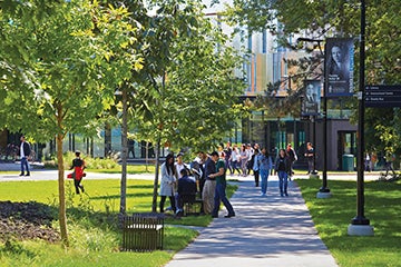 Students walking outside the University of Toronto Mississauga's library.