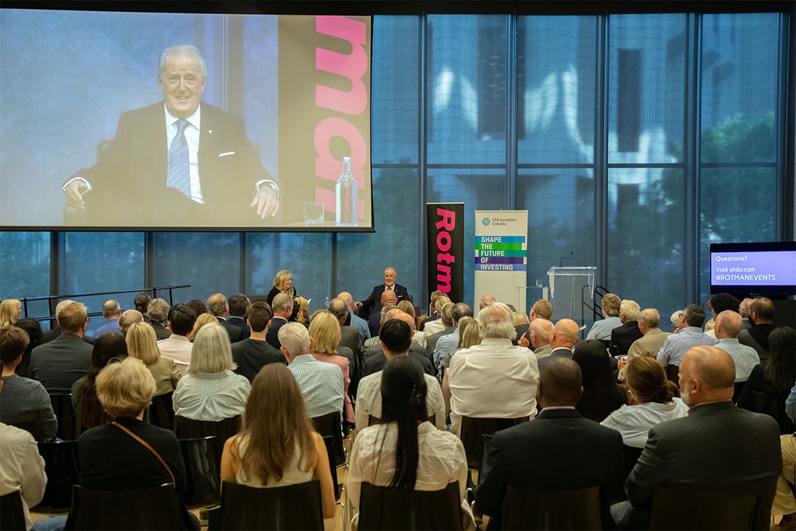 A full house watches Brian Mulroney and Pamela Wallin speak on stage