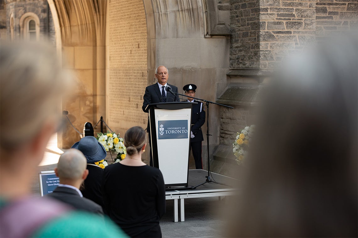 Meric Gertler speaks at a podium during the event