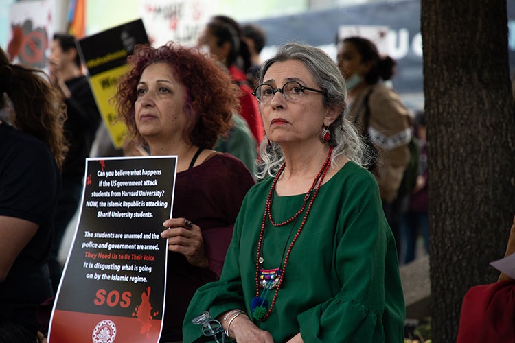 Shahrzad Mojab stands at a rally that began on the St. George campus