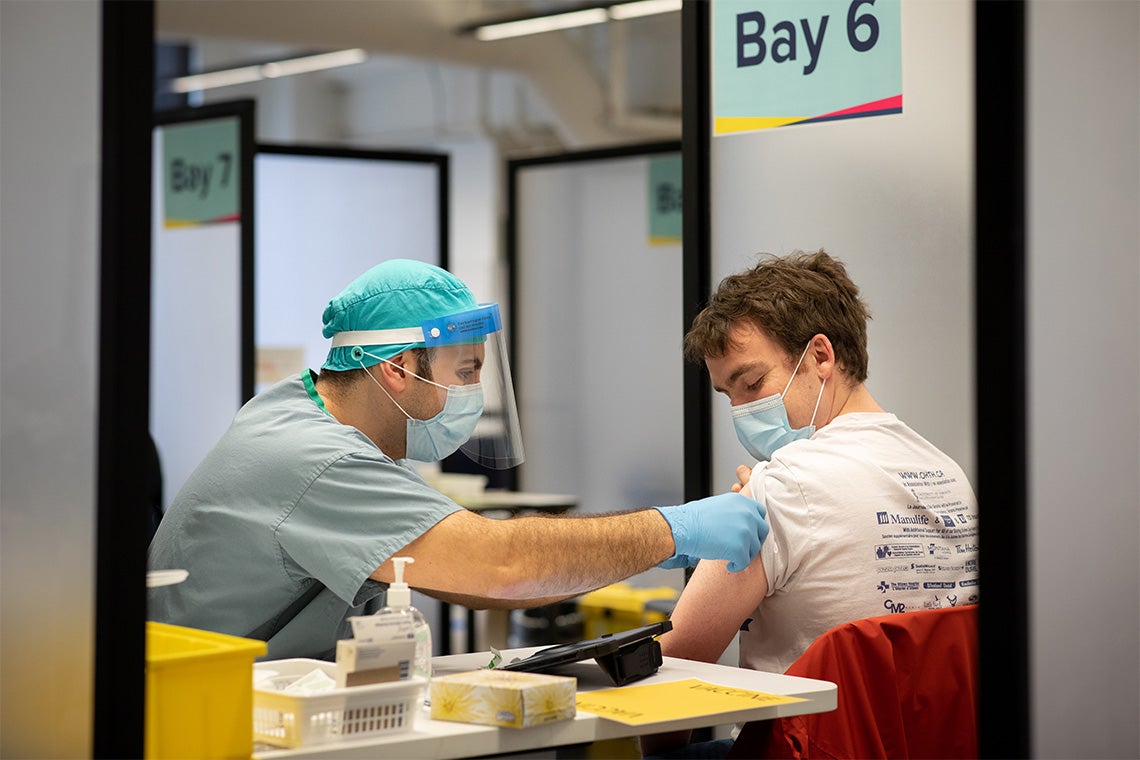 Stefan Juckes getting vaccinated on the St. George campus