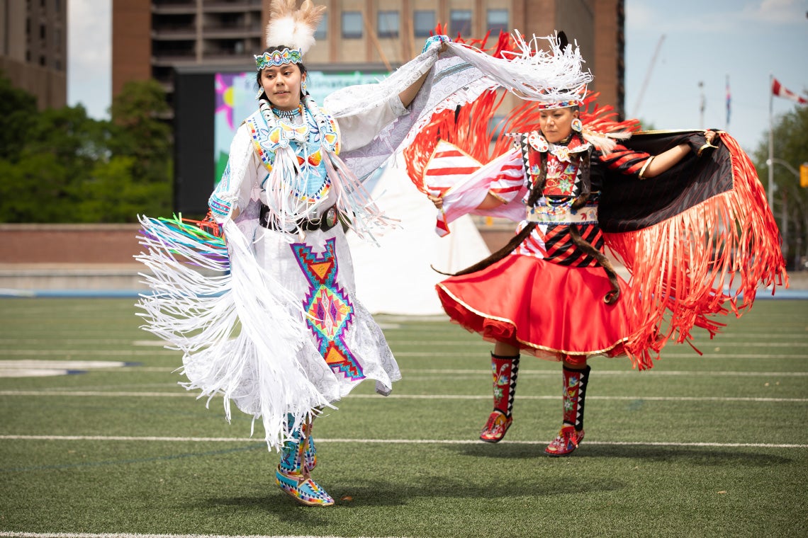 A powwow outside a U of T vaccine clinic