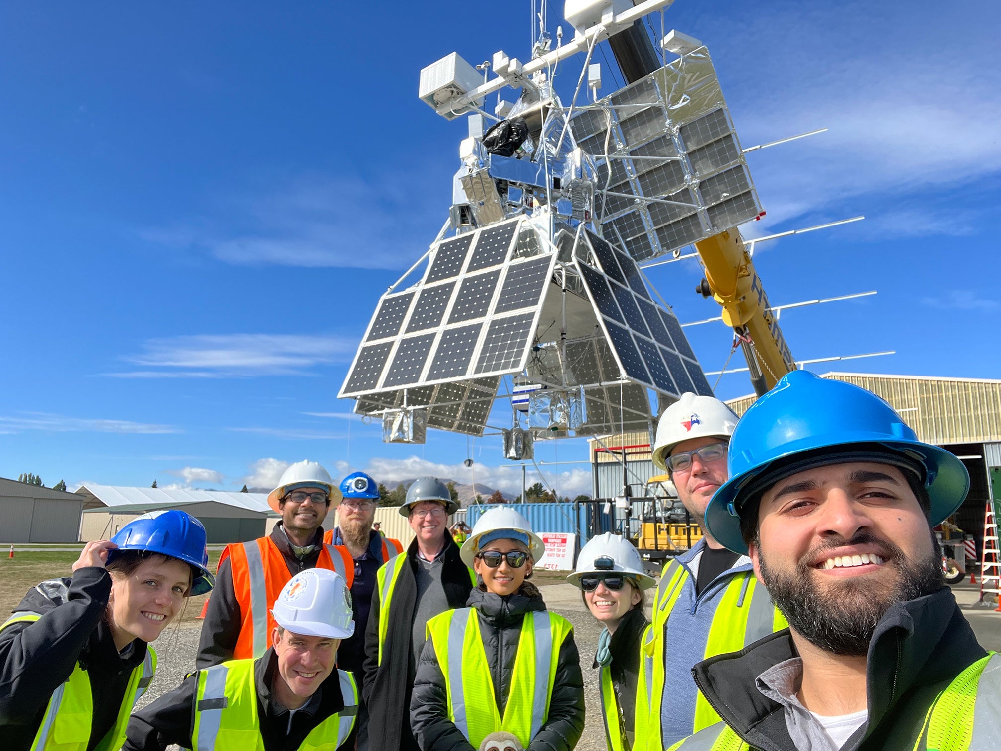 Members of the SuperBIT team prepare for a flight test