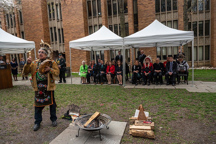 Elder Garry Sault of the Mississaugas of the Credit First Nation presides over an outdoor ceremony