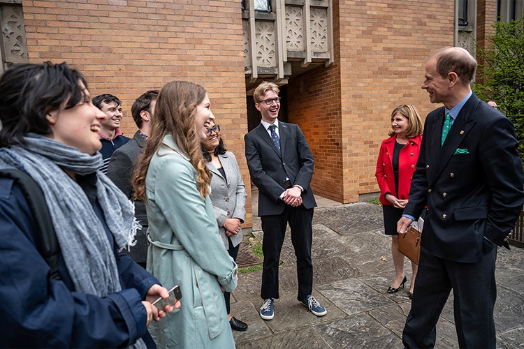 Prince Edward chats with a group of students and Massey junior fellows
