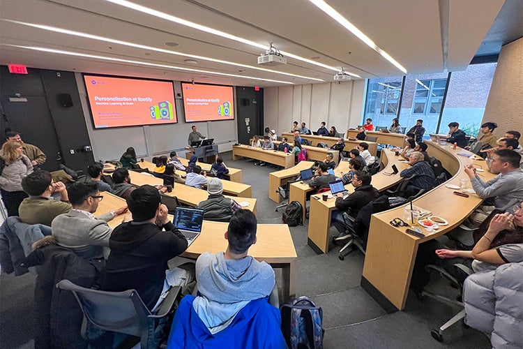 People seated in a conference room