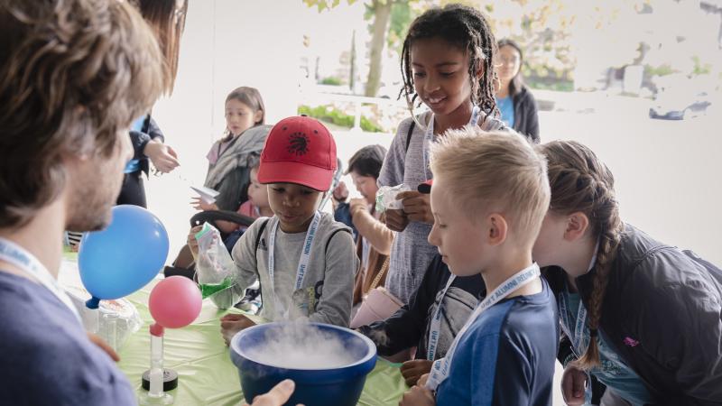 young children participate in a science experiment