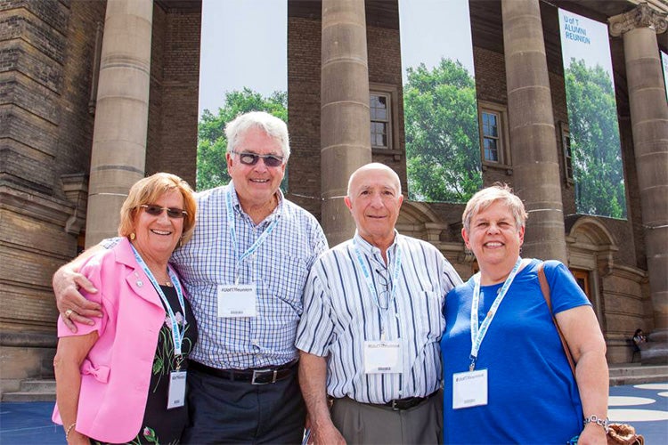 a group of seniors stand outside convocation hall during alumni reunion