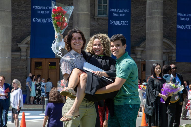 grad being lifted up