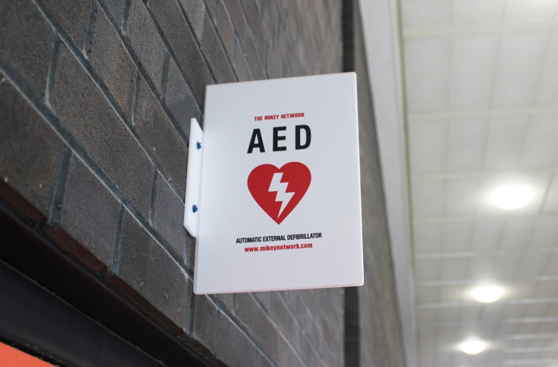 A sign showing the location of an Automated External Defibrillator