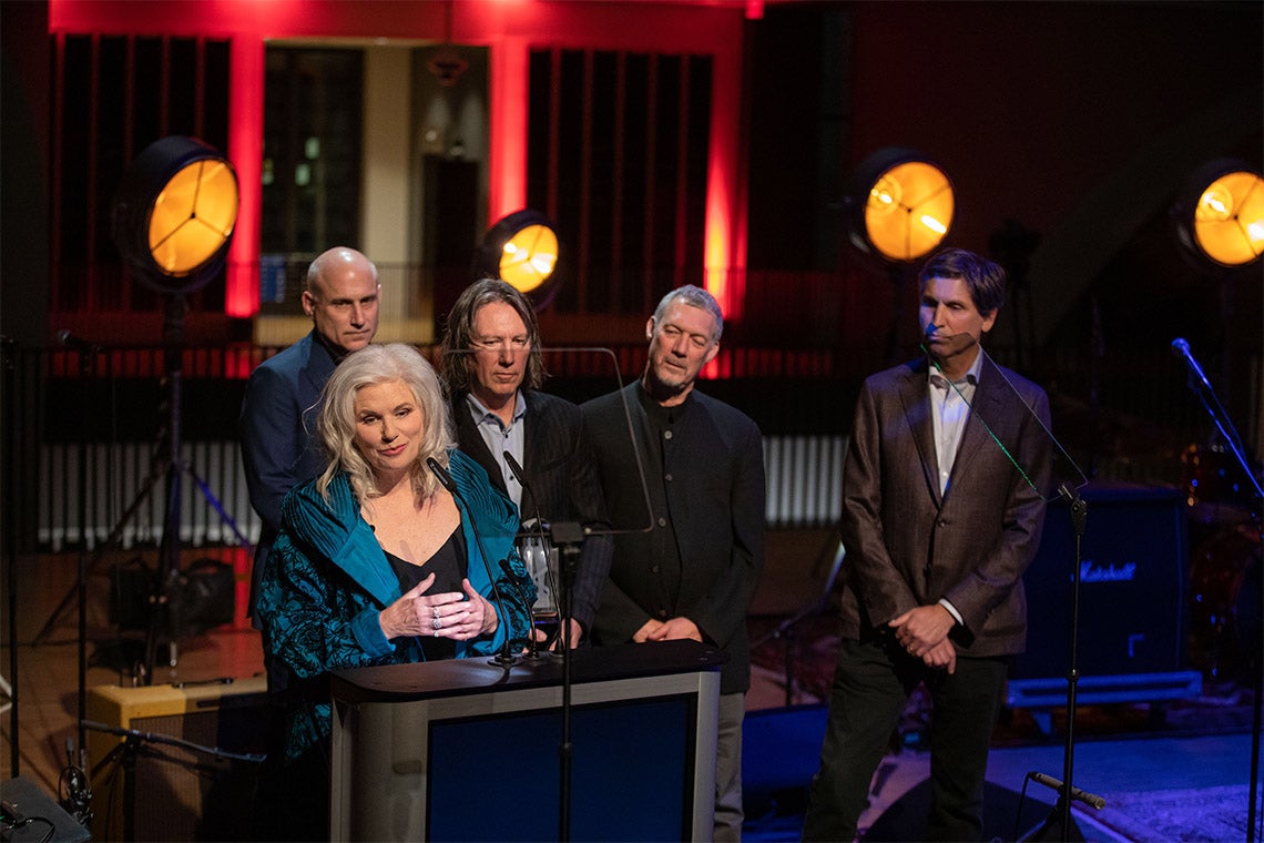 Margot Timmins and the rest of the Cowboy Junkies behind her, gives a speech after being inducted into the hall of fame