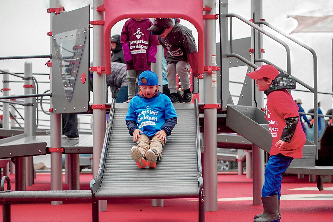 Children using an accessible playground built in Charlottetown, PEI