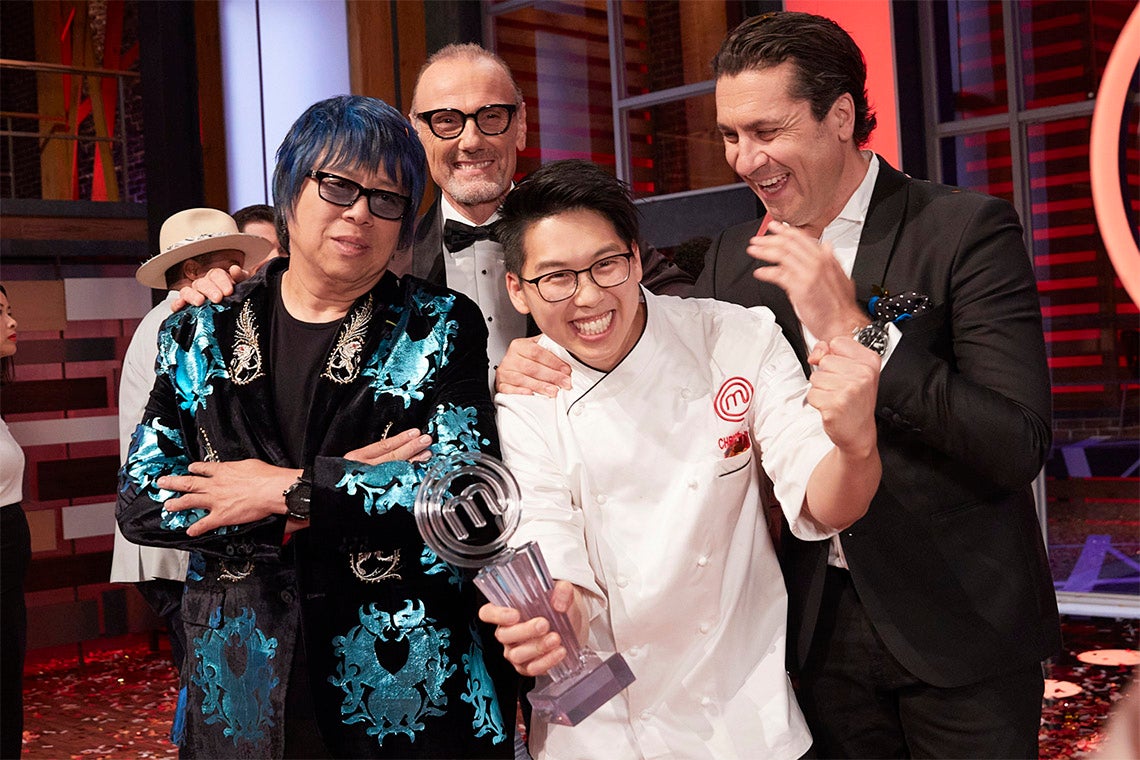 Christopher Siu holds the winner's trophy and poses with the masterchef judges