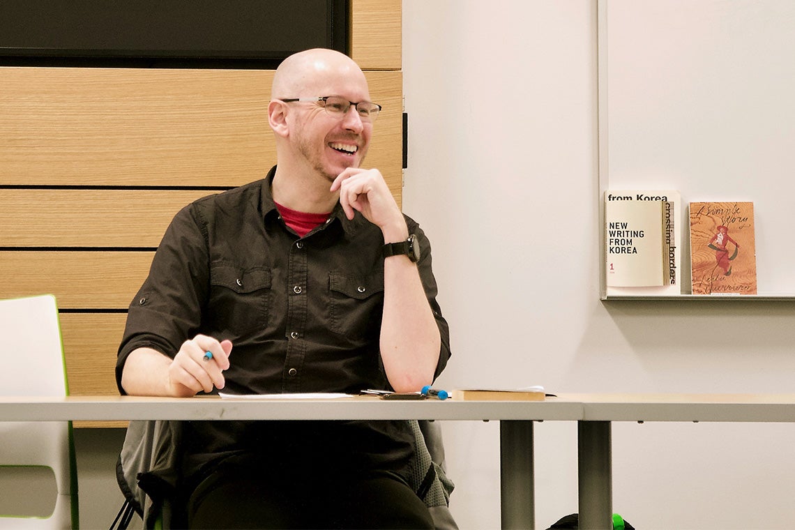 Nathan Sanders has a laugh while teaching his class