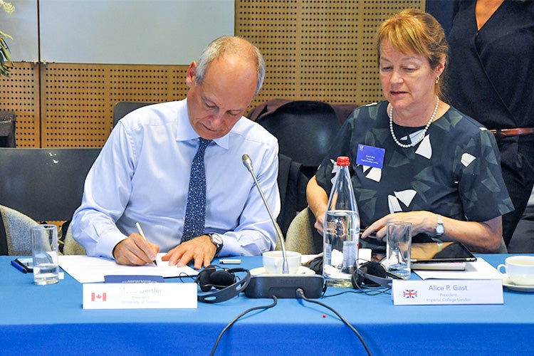 Meric Gertler signs the final declaration