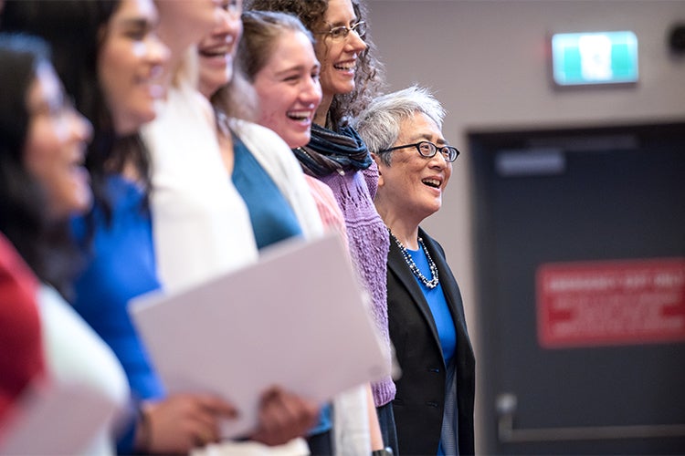 Carol Chan sings with the choir during her installation ceremony at Woodsworth College