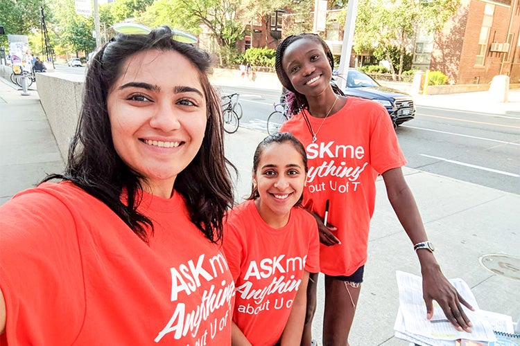 students wearing ask me anything shirts