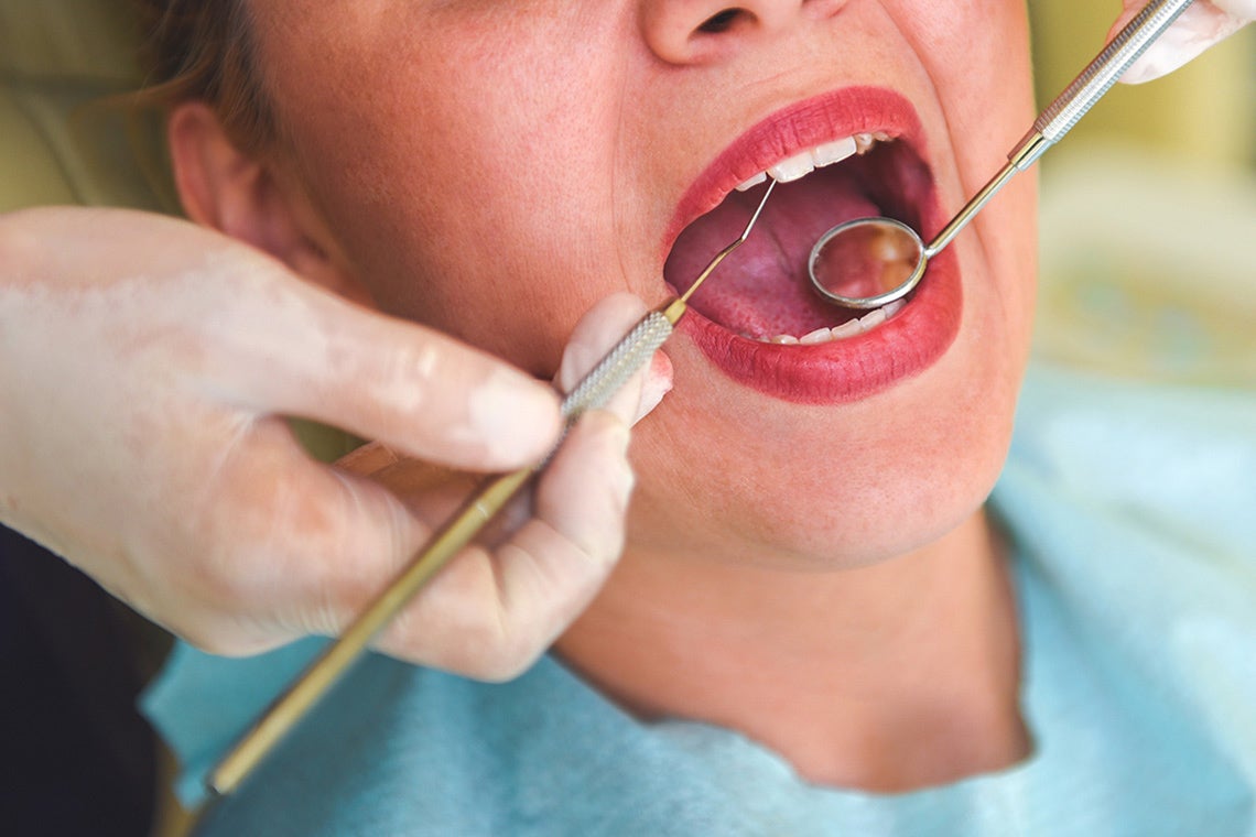 Photo of dentist examining a patient