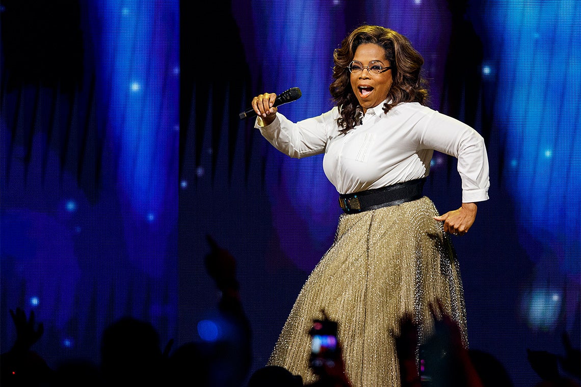 Oprah Winfrey struts across the stage at an event in Vancouver